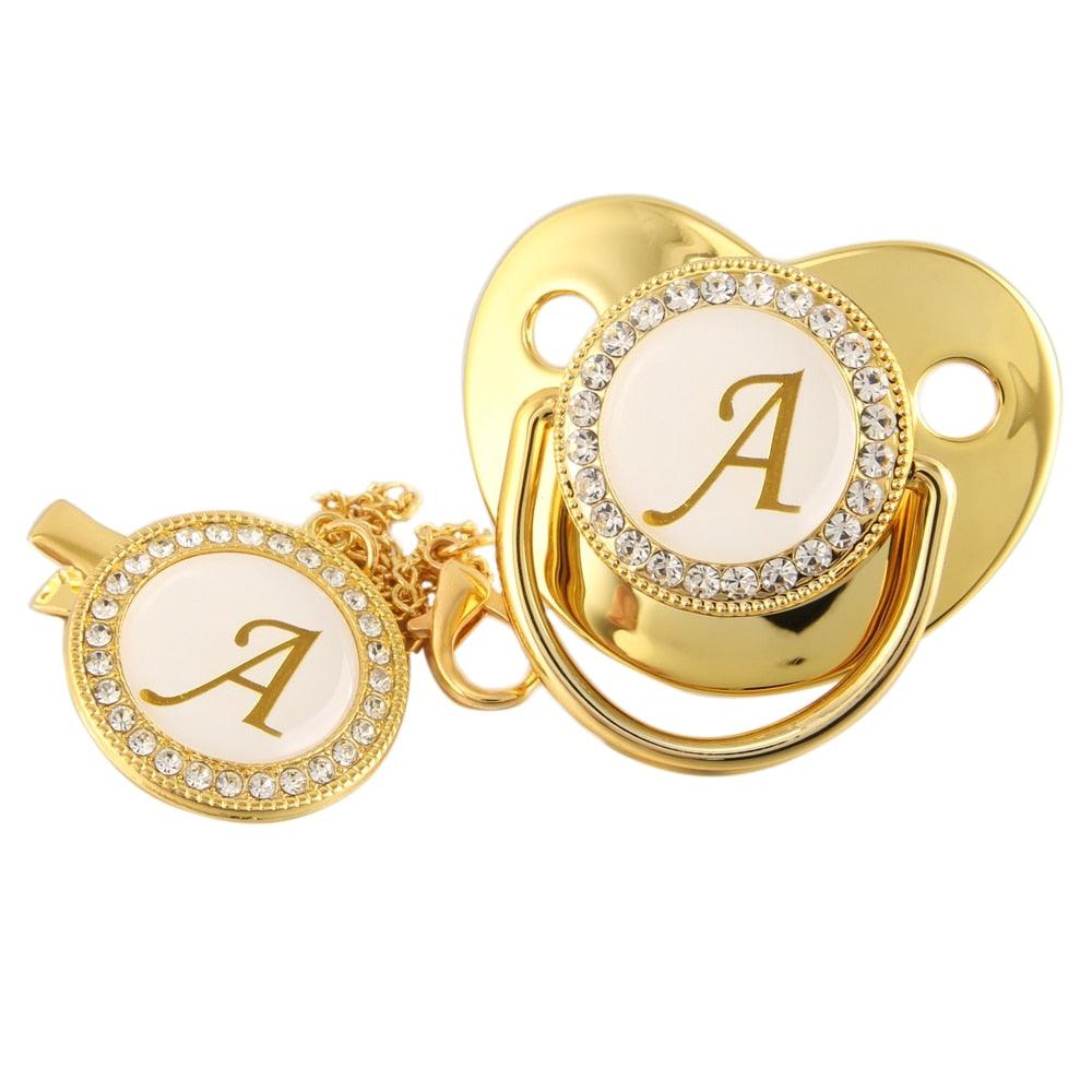 Chupeta Ouro Bling com a Letra Inicial do Seu Bebê - Lojas Promorin